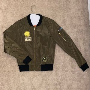 Green patched bomber jacket